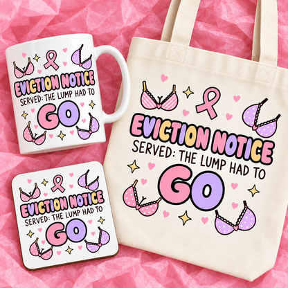 Matching breast cancer awareness gift set with 11oz mug, square ceramic coaster and tote bag on pink tissue paper.