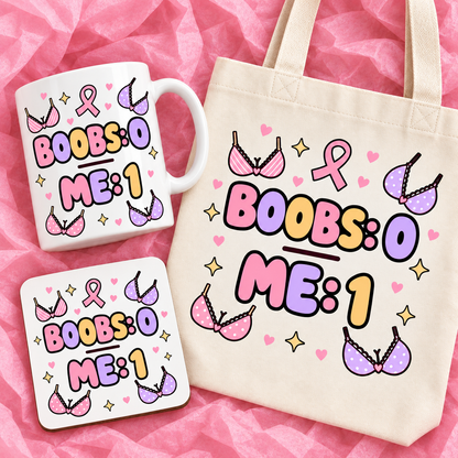 Matching breast cancer awareness gift set with 11oz mug, square ceramic coaster and tote bag on pink tissue paper.