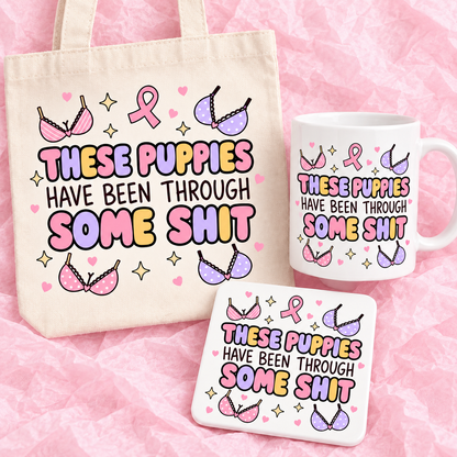 Matching breast cancer awareness gift set with 11oz mug, square ceramic coaster and tote bag on pink tissue paper.