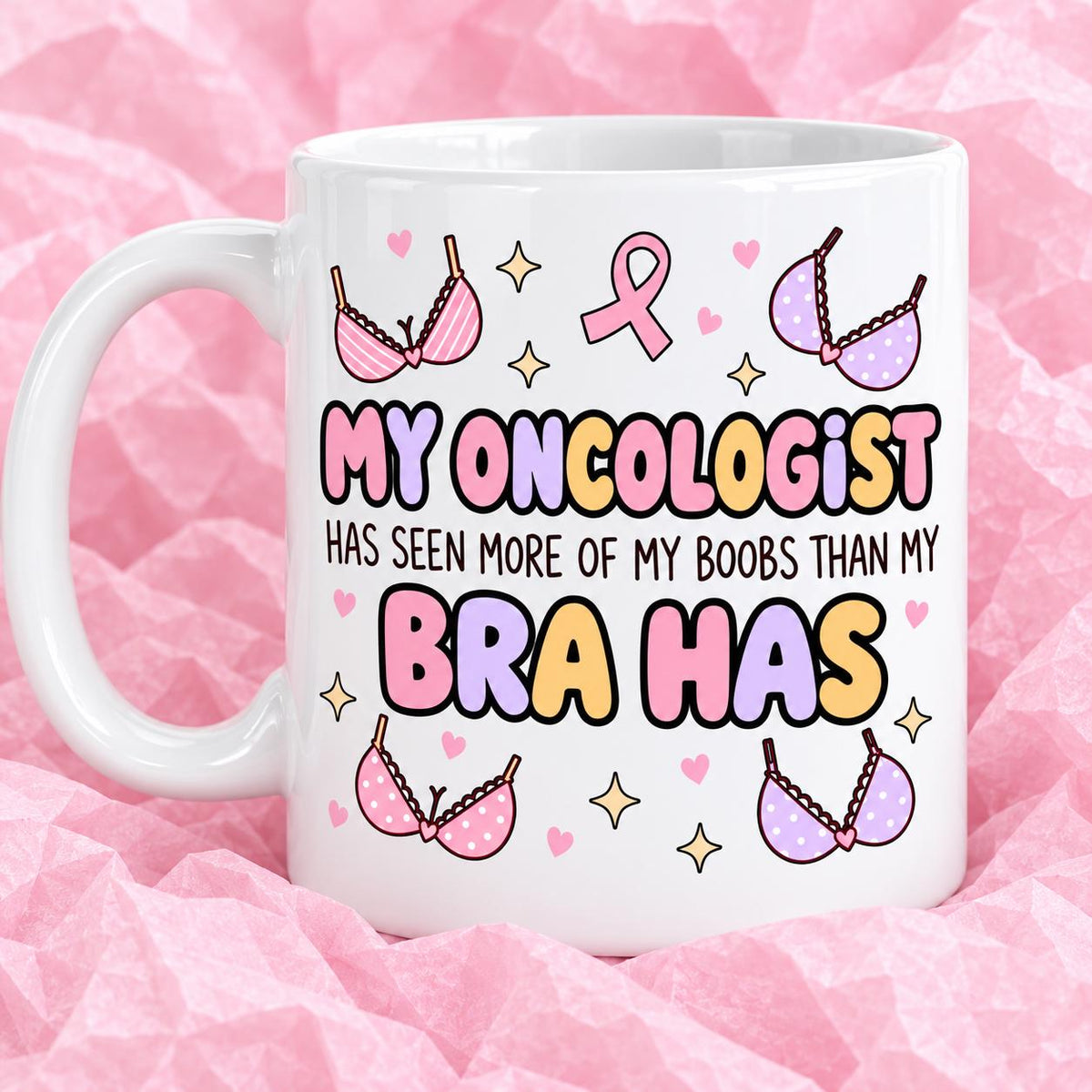 Breast cancer awareness 11oz ceramic mug with funny survivor design on pink tissue paper.