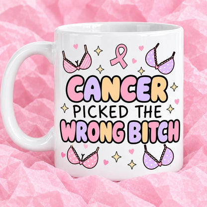 Breast cancer awareness 11oz ceramic mug with funny survivor design on pink tissue paper.