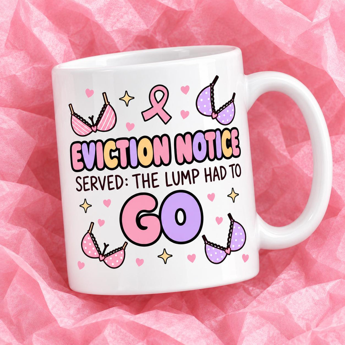Breast cancer awareness 11oz ceramic mug with funny survivor design on pink tissue paper.