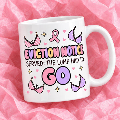 Breast cancer awareness 11oz ceramic mug with funny survivor design on pink tissue paper.