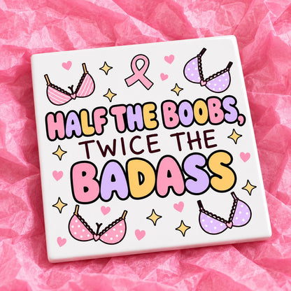 Square 10x10cm ceramic breast cancer awareness coaster with survivor design on pink tissue paper.