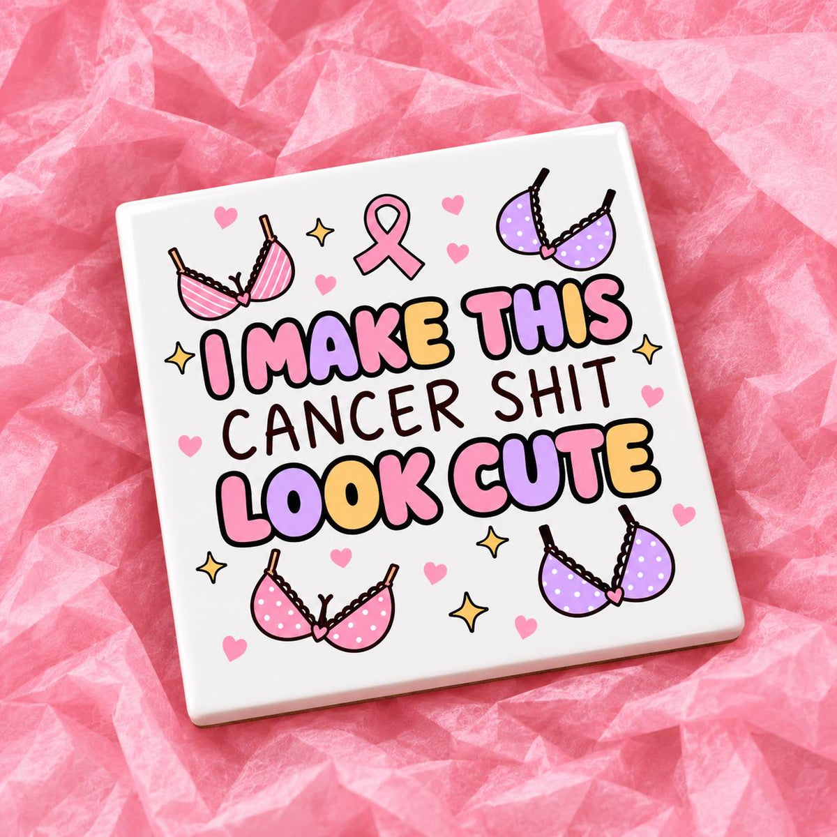 Square 10x10cm ceramic breast cancer awareness coaster with survivor design on pink tissue paper.
