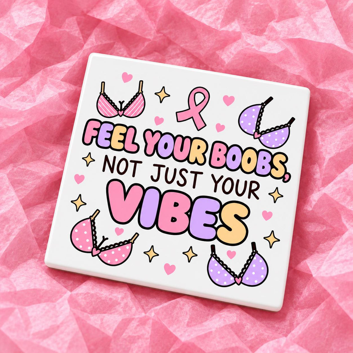 Square 10x10cm ceramic breast cancer awareness coaster with survivor design on pink tissue paper.