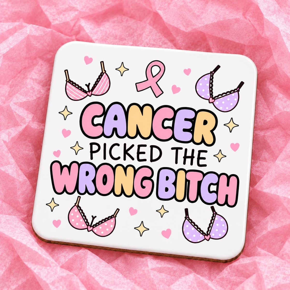 Square 10x10cm ceramic breast cancer awareness coaster with survivor design on pink tissue paper.