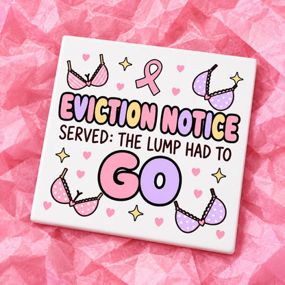Square 10x10cm ceramic breast cancer awareness coaster with survivor design on pink tissue paper.