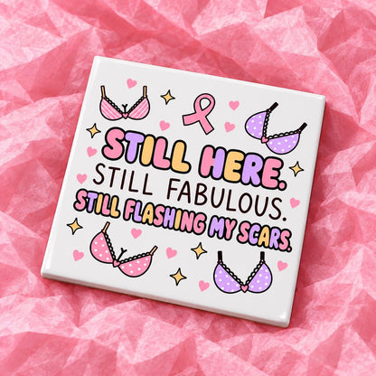 Square 10x10cm ceramic breast cancer awareness coaster with survivor design on pink tissue paper.