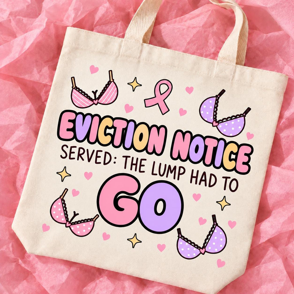 Breast cancer awareness 15x13 inch tote bag with funny survivor design on pink tissue paper.