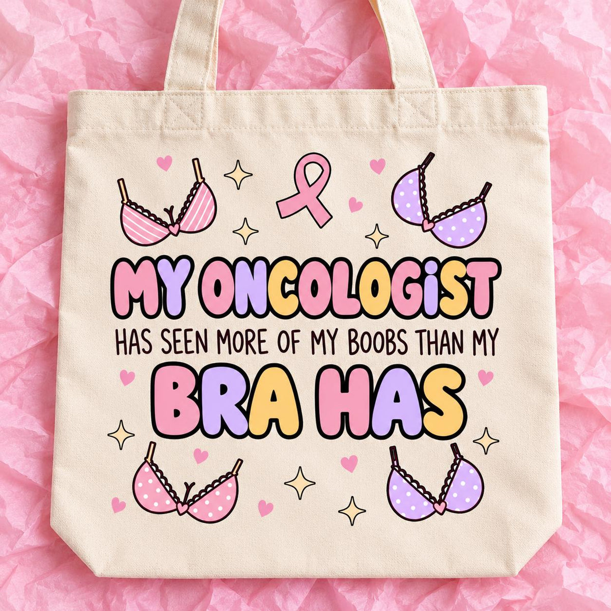 Breast cancer awareness 15x13 inch tote bag with funny survivor design on pink tissue paper.