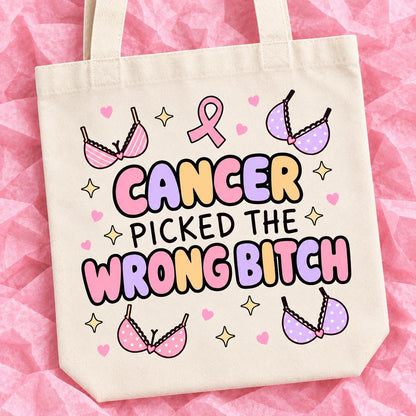 Breast cancer awareness 15x13 inch tote bag with funny survivor design on pink tissue paper.