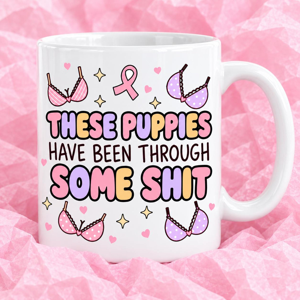 Breast cancer awareness 11oz ceramic mug with funny survivor design on pink tissue paper.