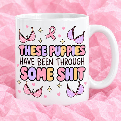 Breast cancer awareness 11oz ceramic mug with funny survivor design on pink tissue paper.