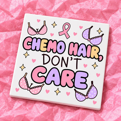 Square 10x10cm ceramic breast cancer awareness coaster with survivor design on pink tissue paper.